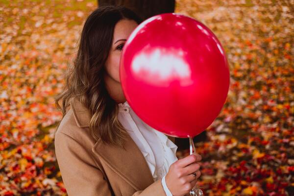 woman with red balloon